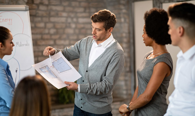 Group of experts reviewing document